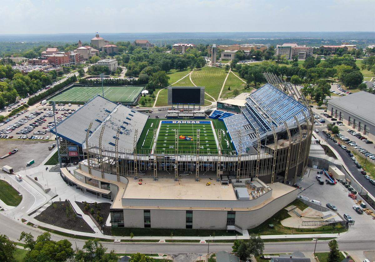 Renovations totaling about $450 million have remade the west and south side of David Booth Kansas Memorial Stadium, seen on Monday, Aug. 18, 2025, at the University of Kansas in Lawrence. This view is from the north looking south towards the campus. The Kansas Jayhawks will open the season when they host Fresno State on Saturday, August 23, 2025, at the stadium. Renovations to the east side of the stadium will happen in the next phase.