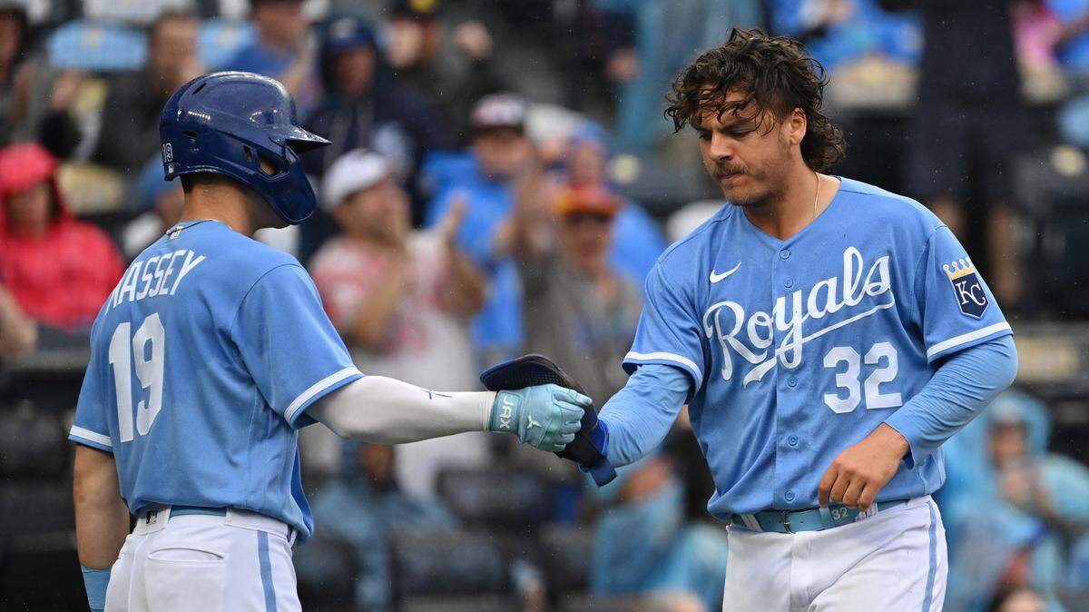 Royals right fielder Nick Pratto (32) celebrates with second baseman Michael Massey (19) after scoring a run against the White Sox at Kauffman Stadium on May 11, 2023.