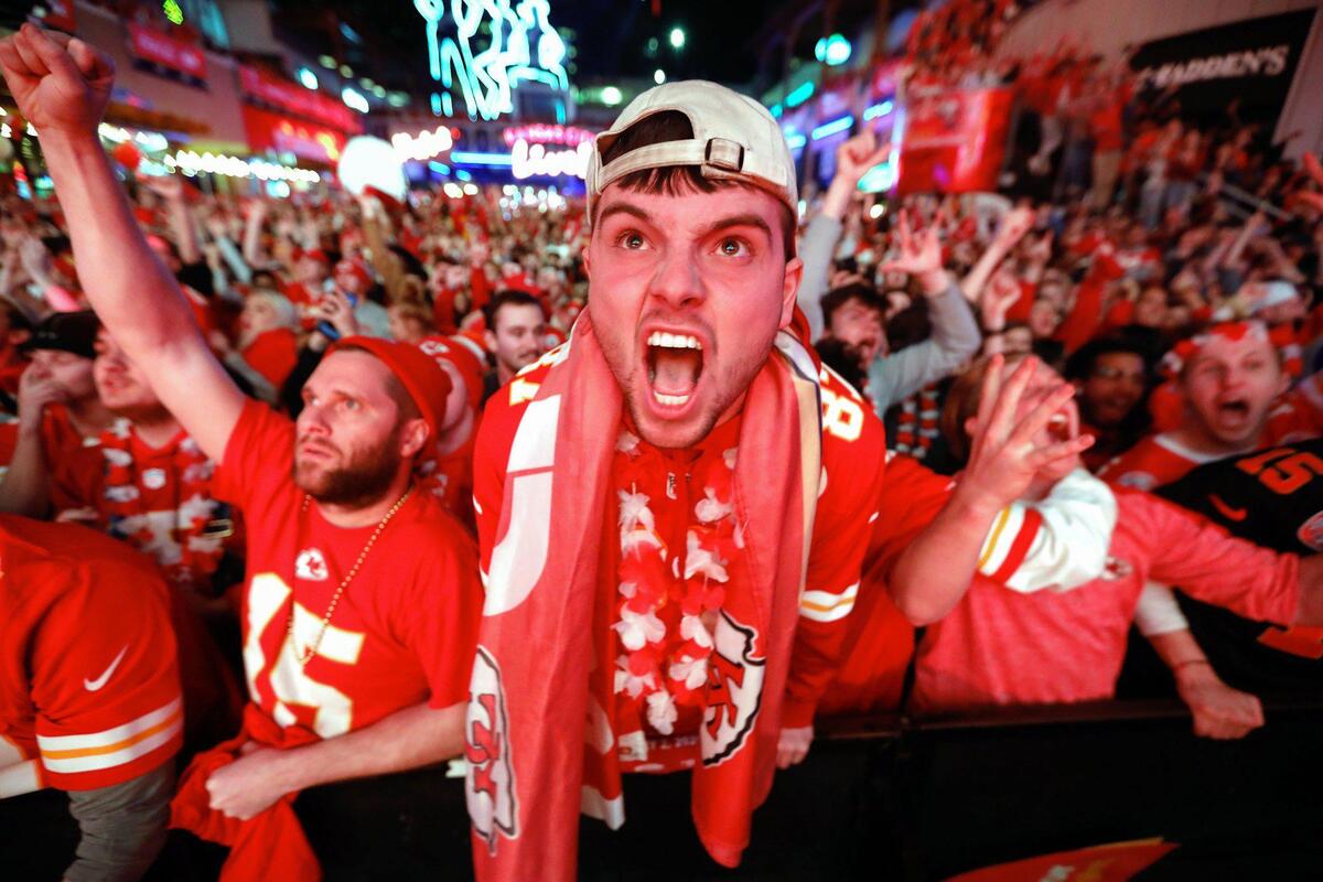 Kansas City Chiefs fans reacted as the Chiefs scored in the fourth quarter of the Super Bowl against the San Francisco 49ers while a large crowd attended the Super Bowl watch party at the Power & Light District Sunday in downtown Kansas City.