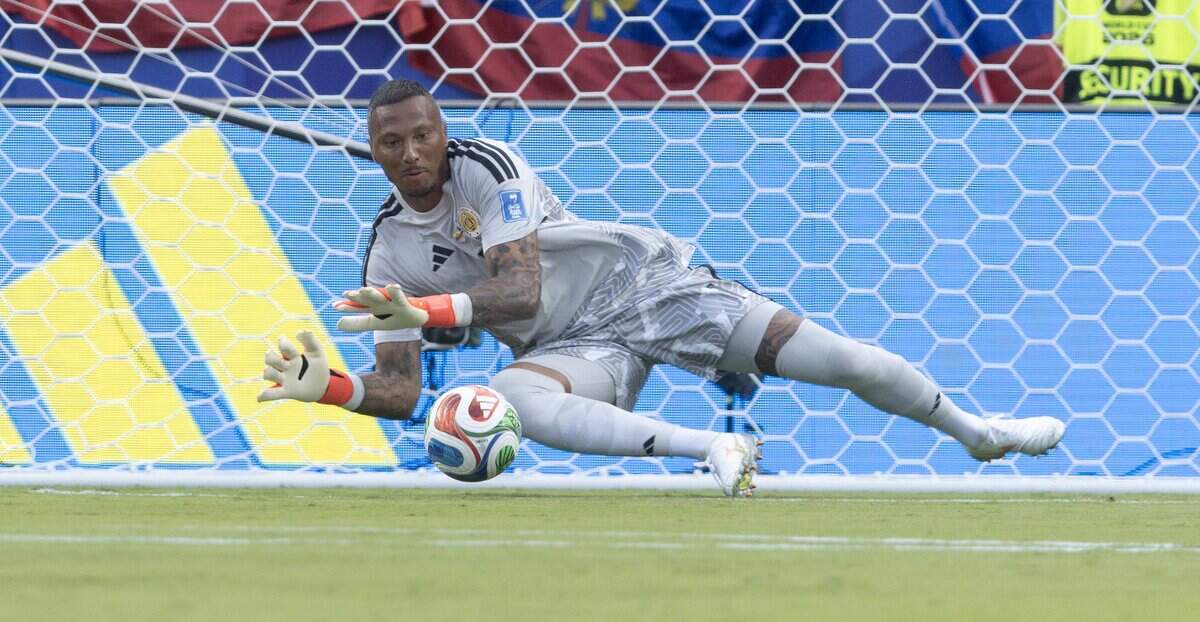 Curaçao goalkeeper Eloy Room (1) makes one of this many saves against Curaçao during the first half of a FIFA World Cup group-stage soccer match at Kansas City (Arrowhead) Stadium in Kansas City on Saturday, June 20, 2026.