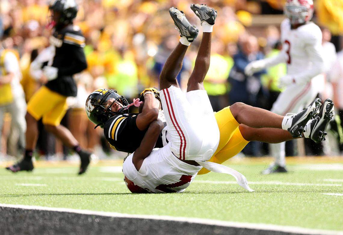 Donovan Olugbode #1 of the Missouri Tigers makes a catch as Dashawn Jones #7 of the Alabama Crimson Tide defends during the second half of the game at Faurot Field at Memorial Stadium on October 11, 2025 in Columbia.