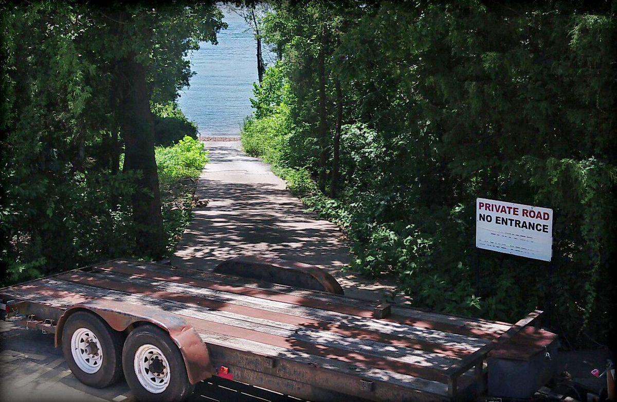 The tree-lined ramp that led the duck boats from land onto Table Rock Lake is now off limits and blocked by a rusting trailer. Nearly a year has passed since 17 people perished when their boat was caught in a storm and sank not far from shore.