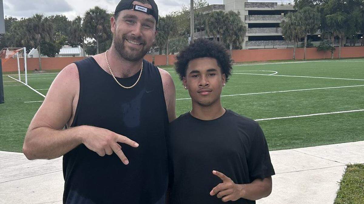 Chiefs tight end Travis Kelce and Chamblee High School quarterback Jazz Lewis.