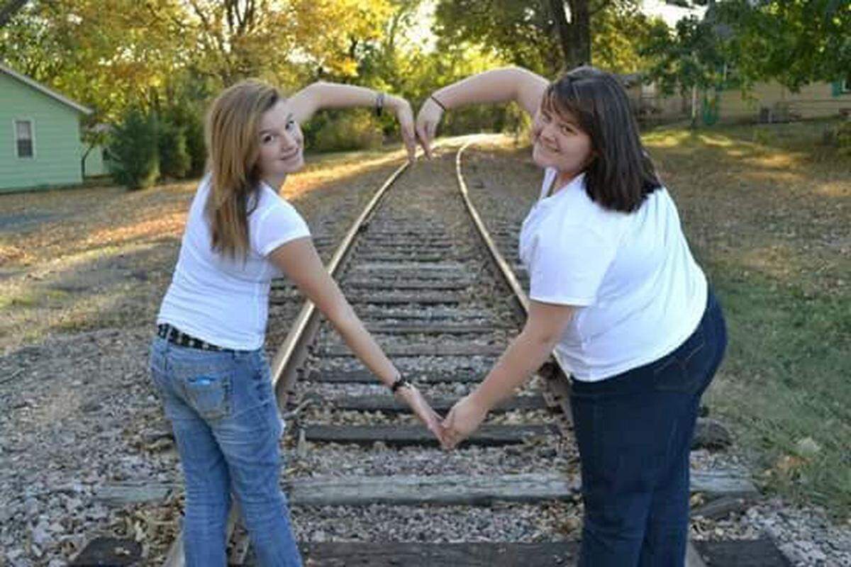 Elizabeth Lindsey was the eldest of three children, seen here with sister, Amie, now Amie Homan, when Lindsey was a teenager.