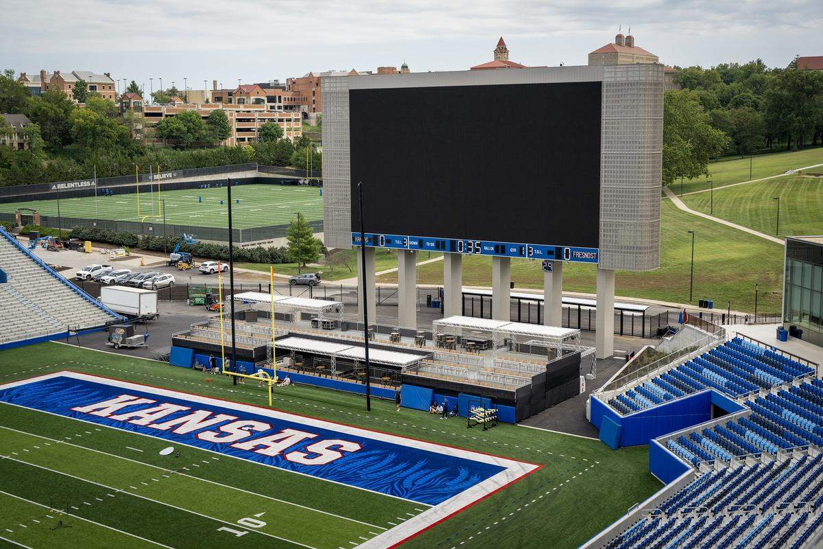 The jumbotron is about 2 1/2 times larger than the previous scoreboard at the renovated David Booth Kansas Memorial Stadium.  The seats, which now have seatbacks, are closer to the field. 