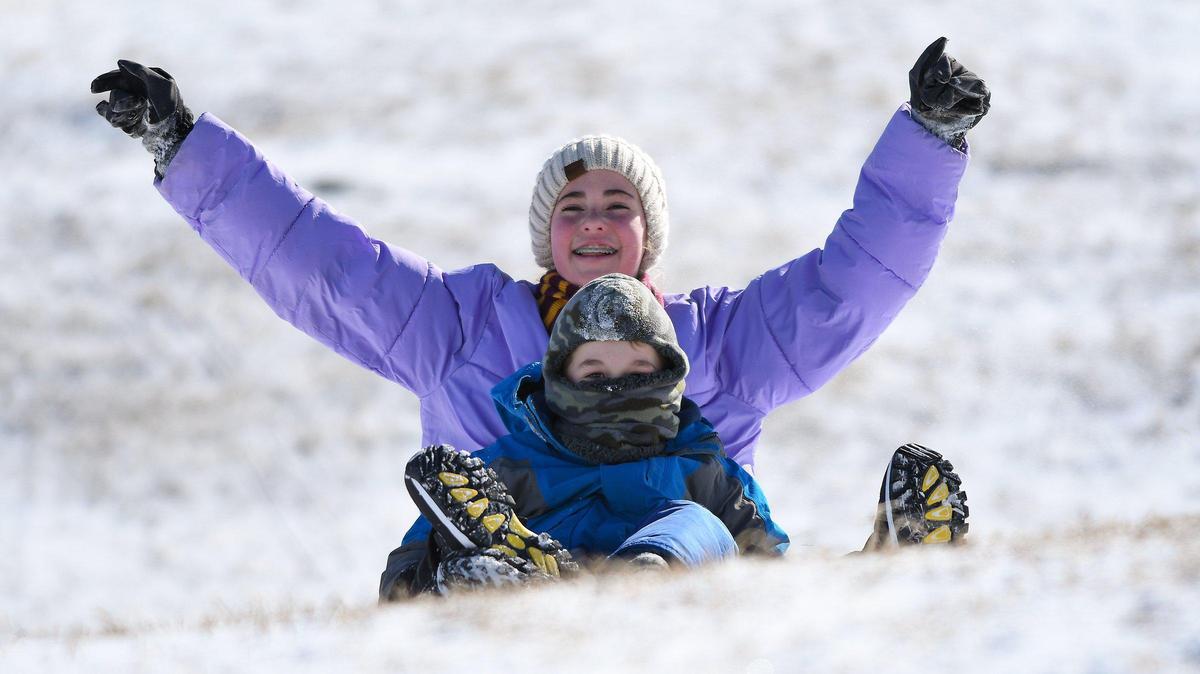 Temperature in the teens didn’t stop 13-year-old Zoe Miller and friend 7-year-old Calvin LeRoy, both of Kansas City, from sledding at Suicide Hill at Brookside Park Thursday.