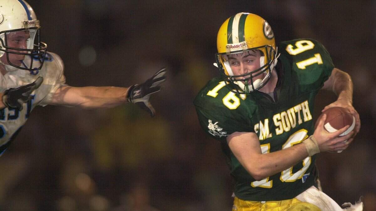 It wasn’t so long ago that new Shawnee Mission North coach Andy Walter was quarterbacking the Shawnee Mission South High School football team. This photo shows him in action in 2000. His first season at the helm of the SM North program arrives this fall.