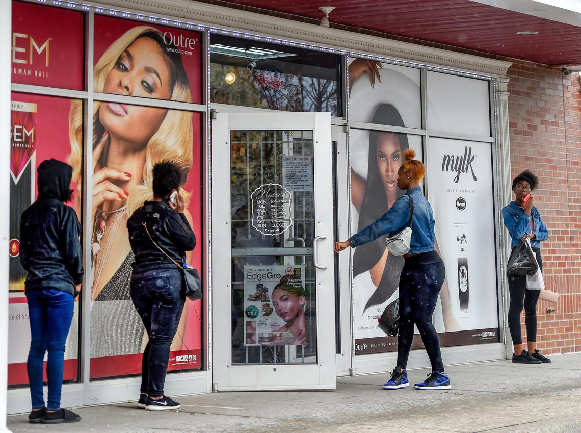 In the wake of COVID-19, Kansas City officials have let Star Beauty, 4704 Virginia Ave., stay open. On Thursday, a line of around a dozen customers waited outside as management was only allowing five customers in at a time.