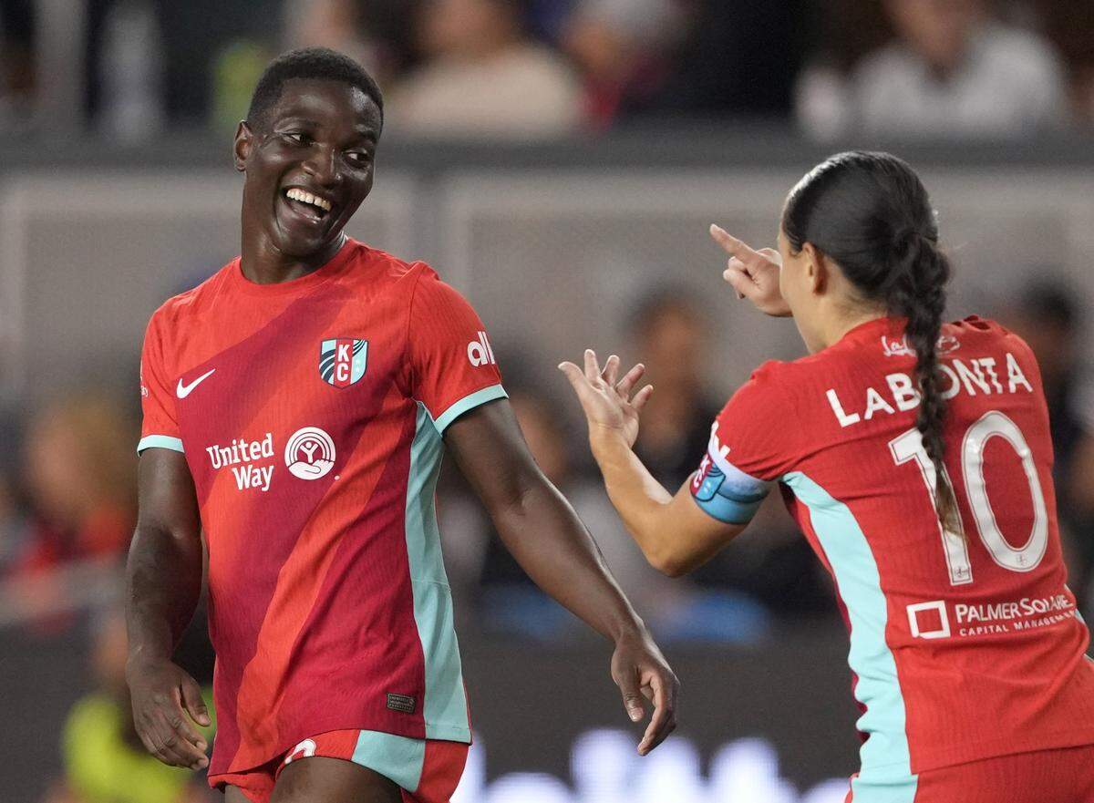 The NWSL’s new all-time single-season scoring queen, Kansas City Current star Temwa Chawinga (left), gets a chuckle as teammate Lo LaBonta counts through the KC forward’s many goals this season during Saturday night’s match at PayPal Park in San Jose, Calif.
