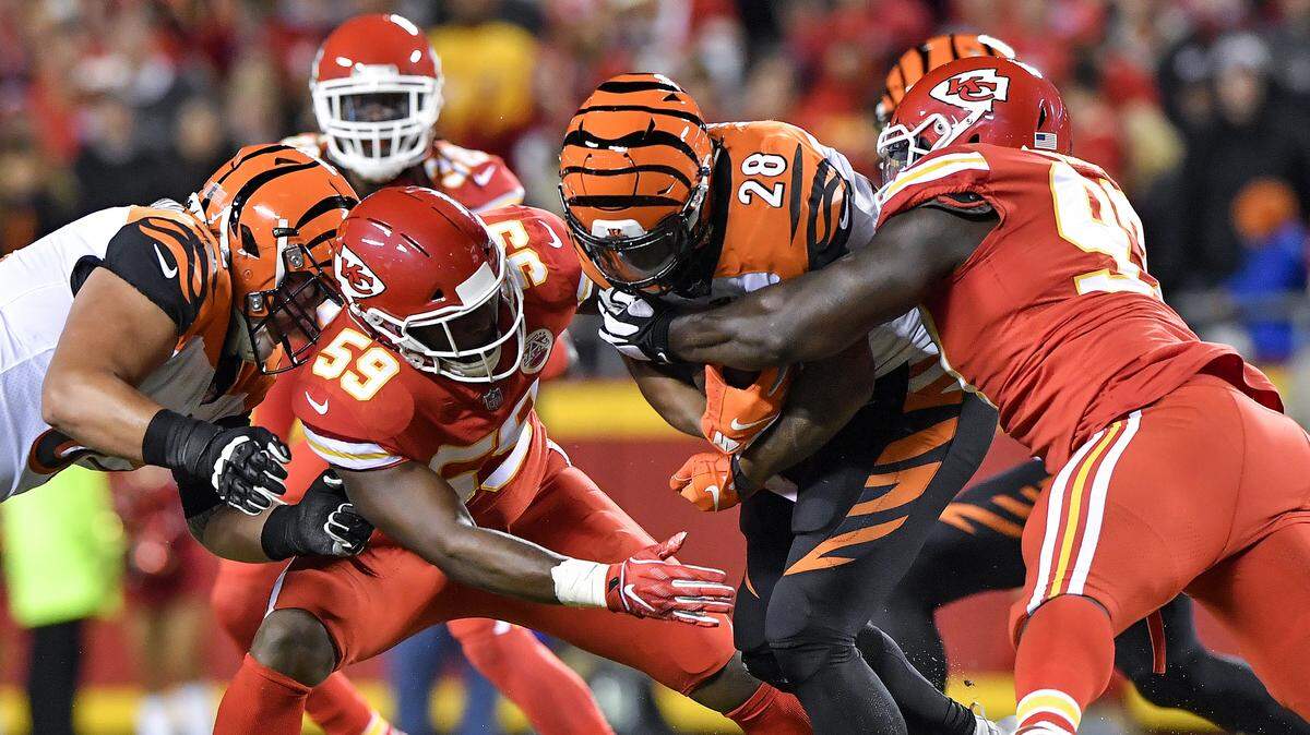 Kansas City Chiefs defensive end Allen Bailey (right) and linebacker Reggie Ragland stopped Cincinnati Bengals running back Joe Mixon on this play in the Chiefs’ win on Oct. 21 at Arrowhead Stadium.