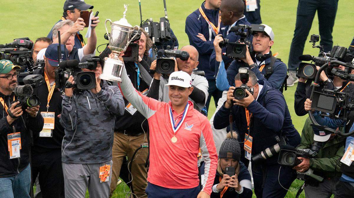 Gary Woodland hoists the trophy after the final round of the 2019 U.S. Open golf tournament at Pebble Beach Golf Links on June 16, 2019.
