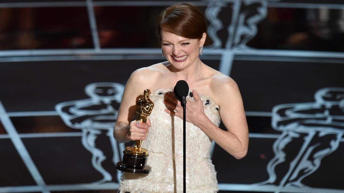 Julianne Moore accepts the award for best actress in a leading role for “Still Alice" at the Oscars on Sunday, Feb. 22, 2015, at the Dolby Theatre in Los Angeles. 