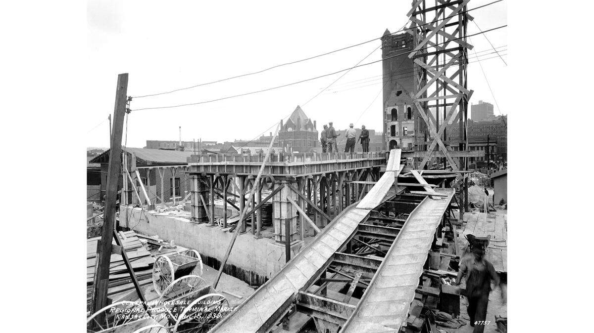 This photo from 1939 shows the construction of the new City Market with the tower from the old City Hall still standing in the background.