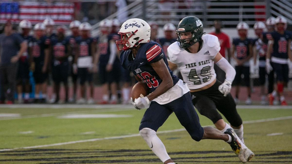 Olathe North’s Jacob Parrish ran with the ball against Lawrence Free State on Friday, September 17, 2021 at the Olathe District Activities Center.
