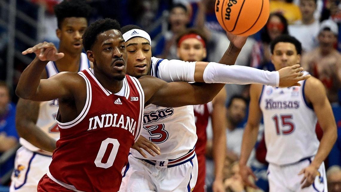 KU’s Dajuan Harris, rear, goes for a steal against Indiana’s Jalen Hood-Schifino during Saturday’s game at Allen Fieldhouse.