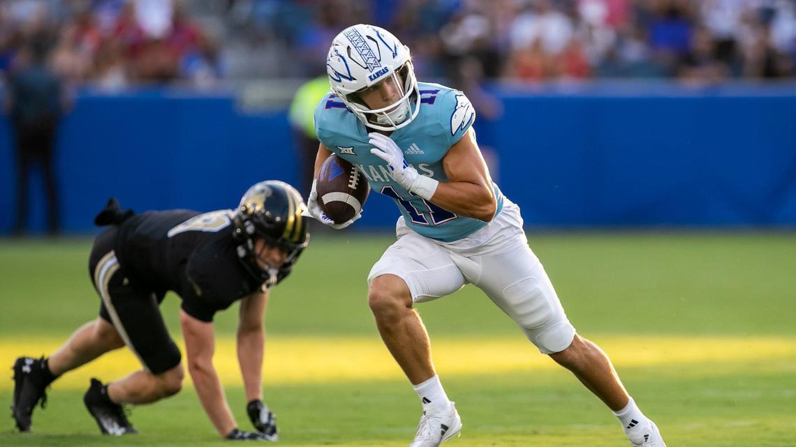 Kansas wide receiver Luke Grimm (11) sheds a tackler after a reception against the Lindenwood Lions on Thursday, August 29, 2024 at Children’s Mercy Park in Kansas City, Kansas.