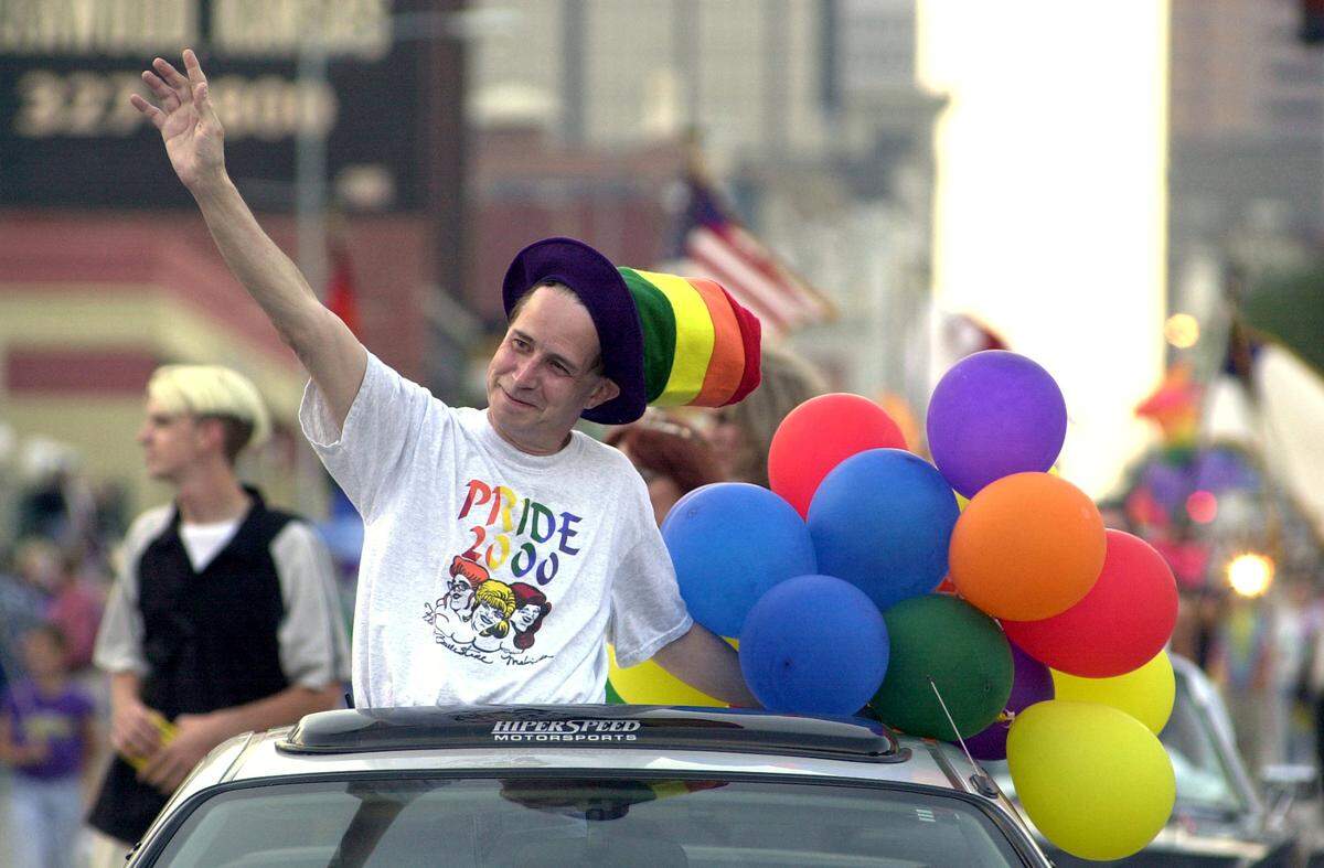 About 1,000 people, including Bill Ford, executive director of Pride Productions, participated in the Pride 2000 parade along 18th and Main streets.