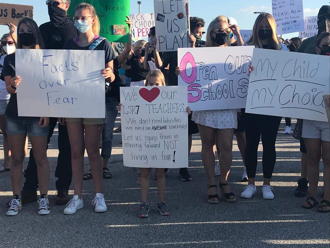 Lee’s Summit parents and students held a rally Wednesday outside the school district administration building supporting opening schools for in-person classes.