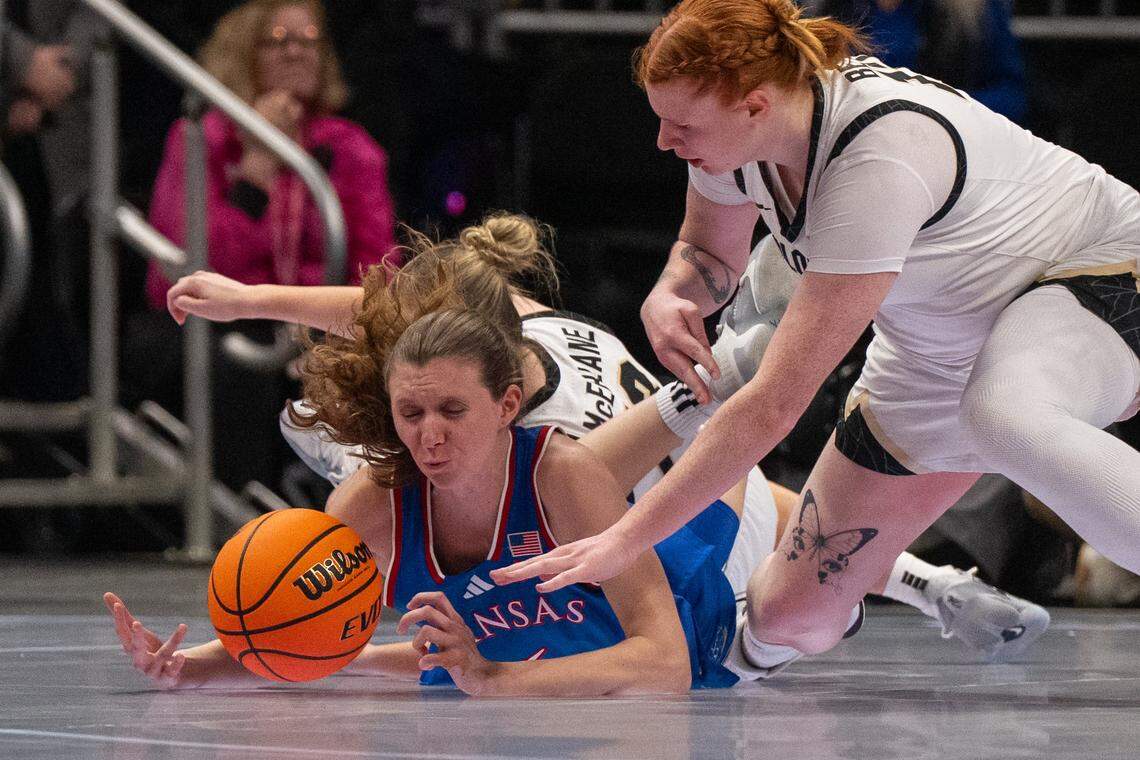 Kansas Jayhawks guard Laia Conesa (6) dives for a loose ball in the first half of KU’s second-round game at the Big 12 Women's Basketball Tournament on Thursday, March 5, 2026, at T-Mobile Center in Kansas City.