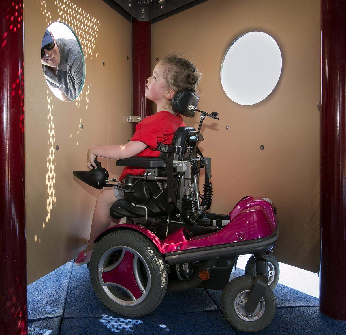 2016 File photo. Olivia Bloomfield, 4, of Leawood, played peek-a-boo with her dad, Matt Bloomfield, at the new Variety KC playground at Tiffany Hills, 9400 N. Congress, during the grand opening Saturday, June 18, 2016. The playground is designed to be inclusive for kids of all abilities. 