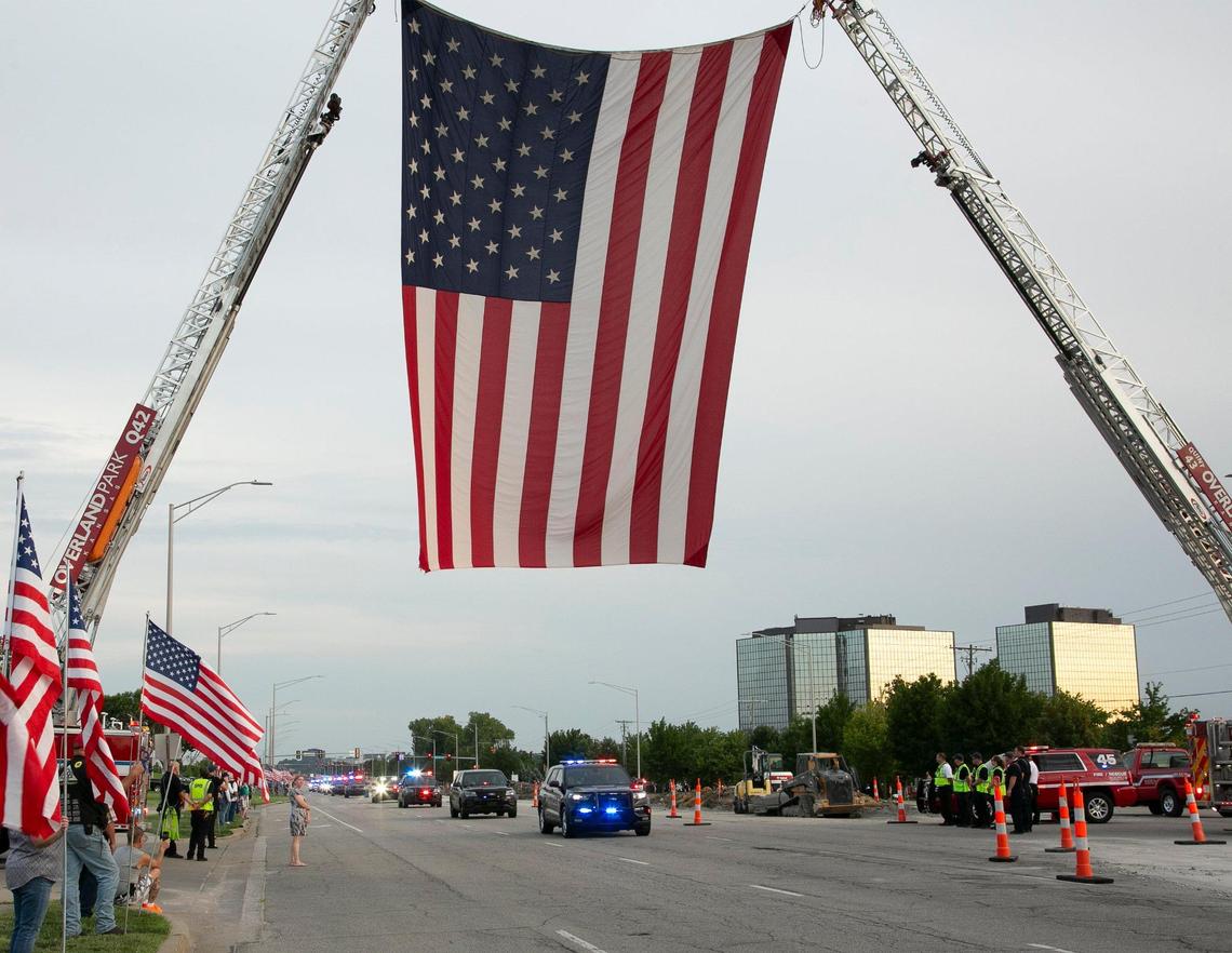 A parade of first responder vehicles left from 93rd Street and Metcalf Avenue in Overland Park on Saturday night in honor of fallen Fairway police officer Jonah Oswald. The vehicles drove through Overland Park, Mission, Fairway and Prairie Village. The procession ended at Harmon Park in Prairie Village, where a candlelight vigil took place.