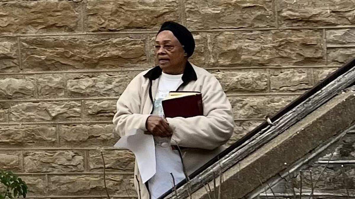 Pearl Douglass Spencer spoke at a recent forgiveness vigil after vandals broke a window at the historic African American Washington Chapel Church.