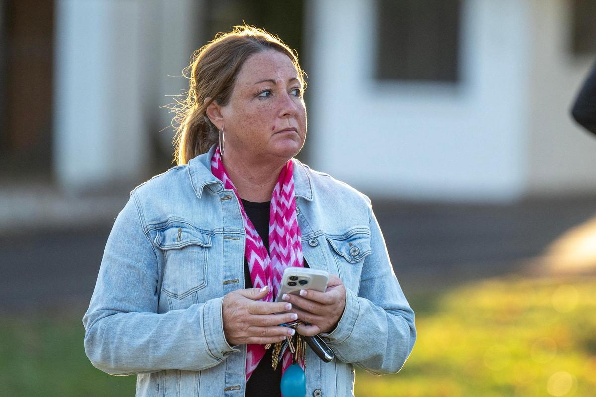 Carrie Lufkin, manager of the Oval Spring Apartments, waits outside the facility after speaking with the media regarding an officer-involved shooting at the Oval Spring Apartments on Thursday, Nov. 7, 2024, in Independence.