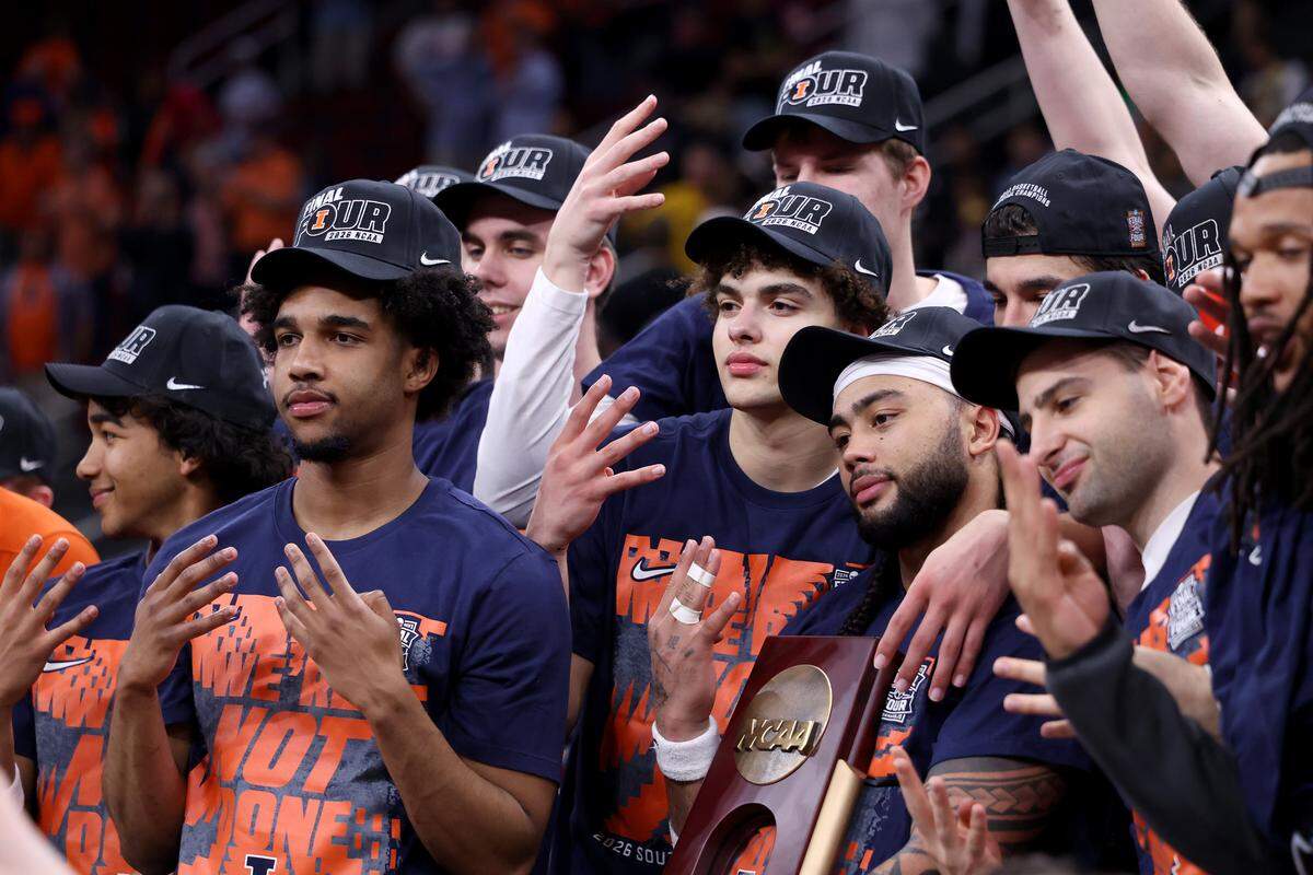 HOUSTON, TEXAS - MARCH 28: Keaton Wagler #23 and Kylan Boswell #4 of the Illinois Fighting Illini pose with the trophy after defeating the Iowa Hawkeyes in the Elite Eight of the 2026 NCAA Men's Basketball Tournament at Toyota Center on March 28, 2026 in Houston, Texas. (Photo by Kenneth Richmond/Getty Images)