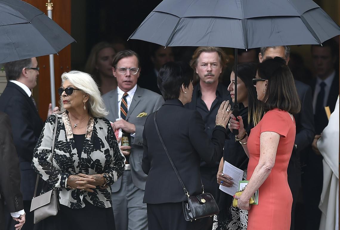 Andy Spade, left, and his brother David, leave with other mourners after the memorial service of the late Kate Spade Thursday, June 21, at Our Lady of Perpetual Help Parish Redemptorist Church, in Kansas City.