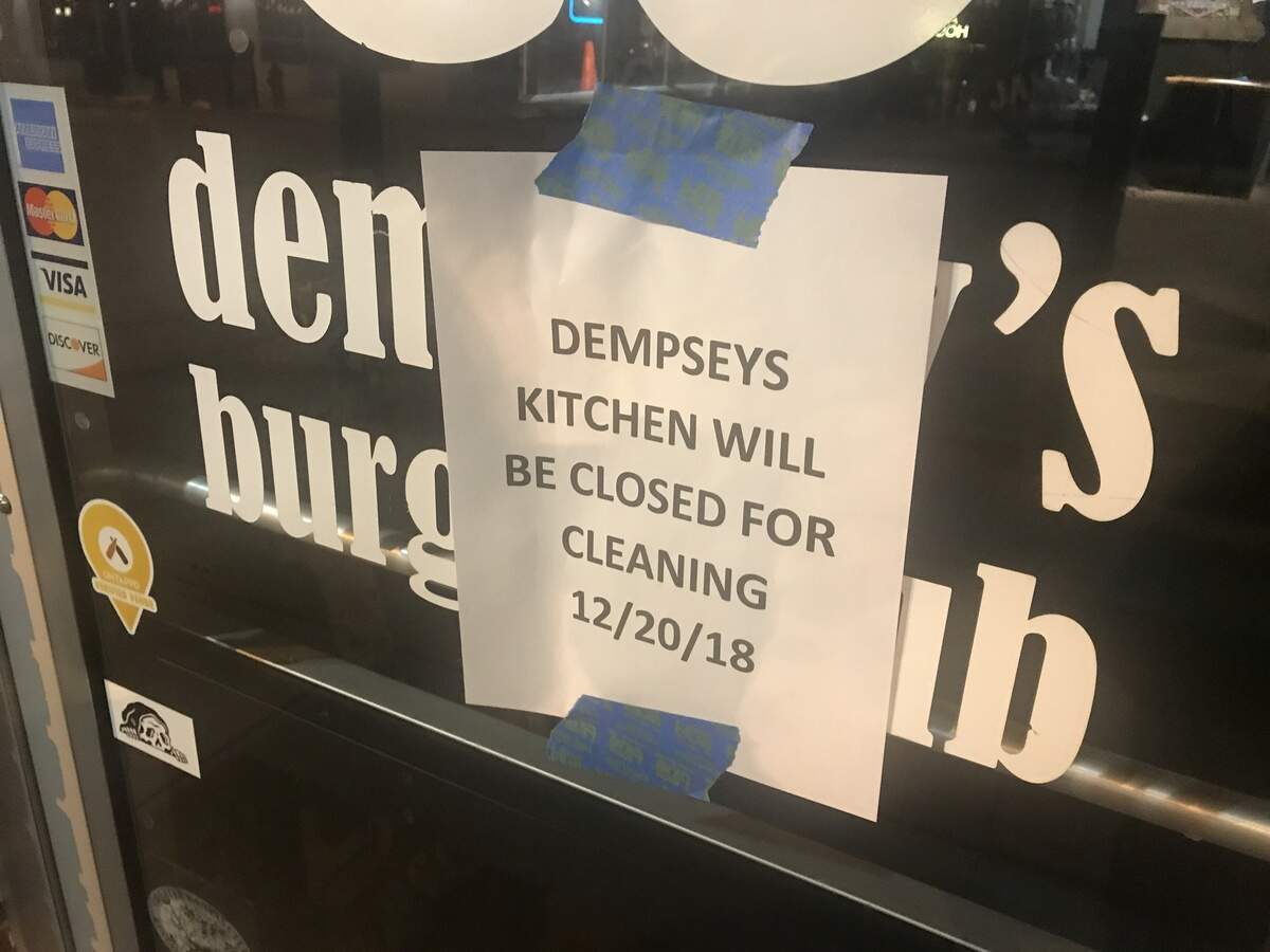 A sign posted on the door of Dempsey’s says it was closed for cleaning Dec. 20.