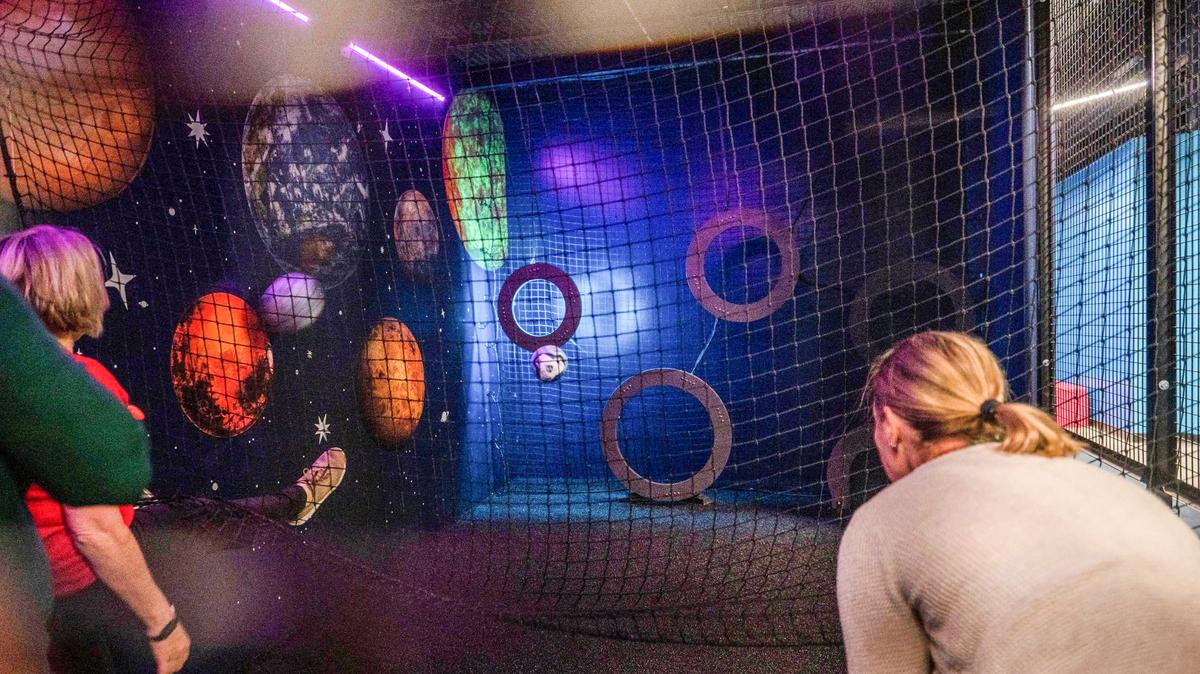 Visitors play a game called Shooting Star at Brkthrough recreation center.
