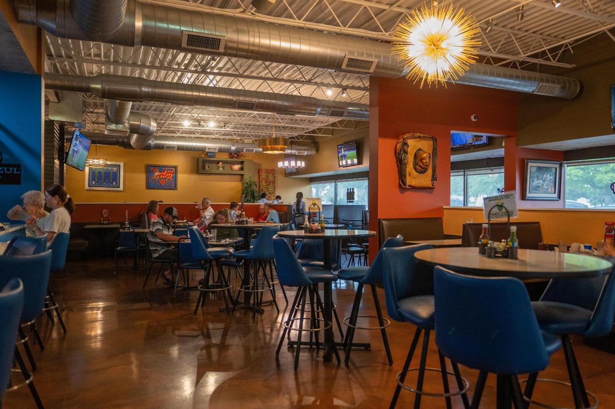 The decor at Dos Reales Mexican restaurant in Overland Park is warm and sunny, with Mexican artwork on the walls.
