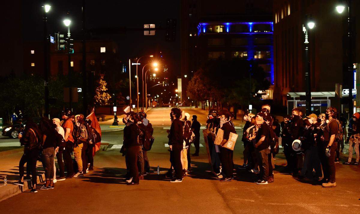 Protesters gather outside Kansas City Police Headquarters after charges in Breonna Taylor case announced on Wednesday, Sept. 23, 2020.