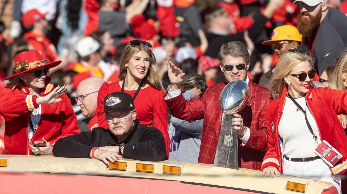 Chiefs coach Andy Reid, and his wife Tammy, along with the Clark Hunt family, make their way down Grand Boulevard with the Super Bowl trophy during the parade on Wednesday.