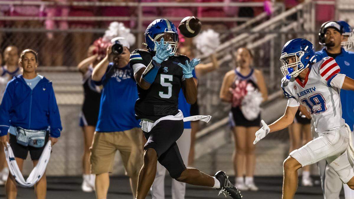 Cam Riley (No. 5) hauls in one of his two touchdown receptions during Blue Springs South’s 42-3 high school football victory over Liberty on Friday, Oct. 10, 2025.