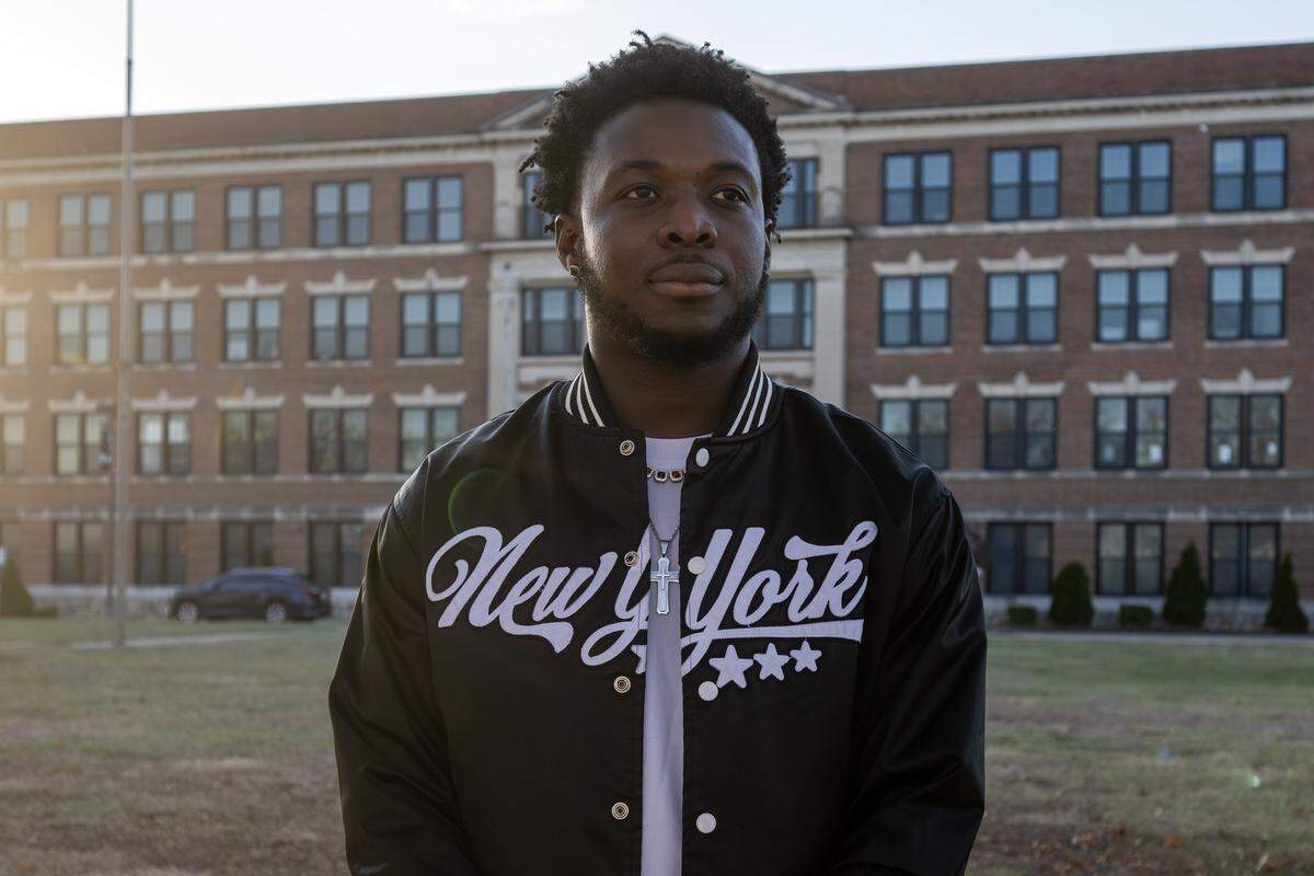Mayson Victor, a young Haitian refugee, stands for a portrait near East High School on Tuesday, Dec. 16, 2025, in Kansas City.