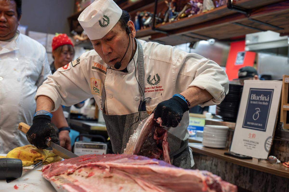 Chef Andy F. Matsuda slices out a piece of bluefin tuna during a cutting show at KC Craft Ramen on Monday, March 2, 2026, in Overland Park.