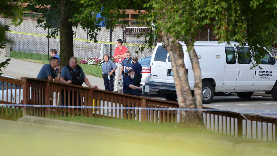 In this file photo, police investigate a fatal shooting Aug. 9 in the parking lot of the Kansas City Zoo. Anthony Meneses, 28, has pleaded guilty to illegally possessing a gun he used to accidentally shoot and kill a 19-year-old man.