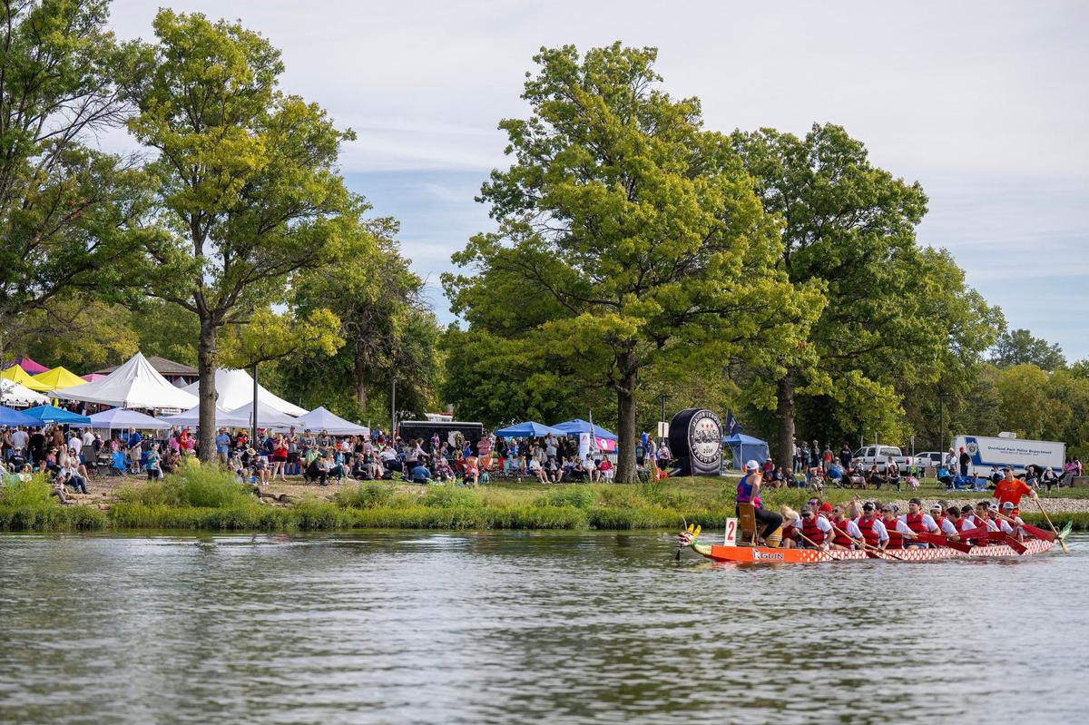 Spectators watch the qualifying races during the KC Dragon Boat Festival on Saturday, Sept. 28, 2024, at Shawnee Mission Park.