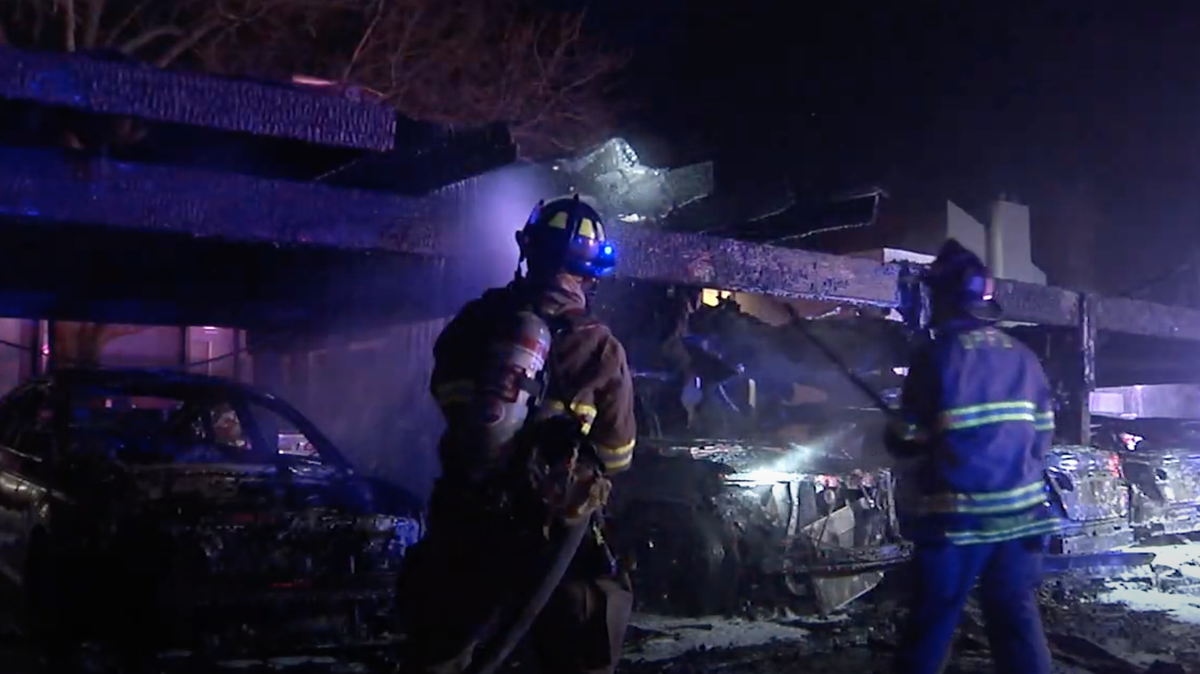 Fire crews put out a blaze that damaged 20 cars early Monday at an Overland Park apartment complex.