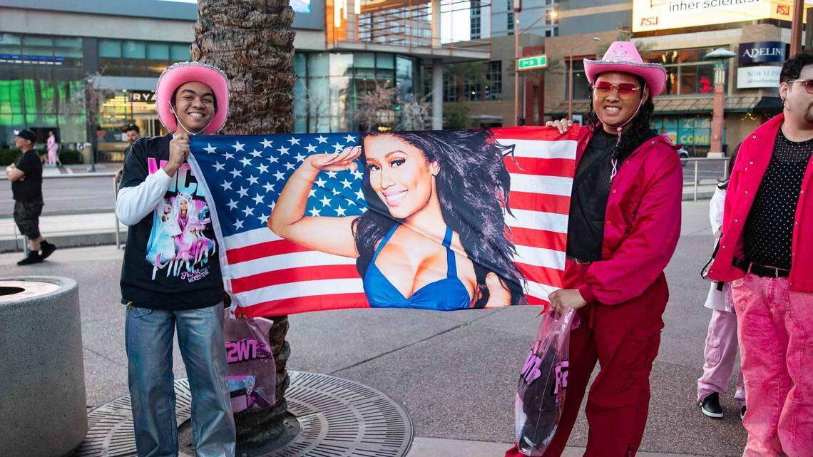 Aiden Galiza (left) and Donate Taifmai pose for a photo as they wait for the doors to open at Footprint Center in Phoenix on March 13, 2024.