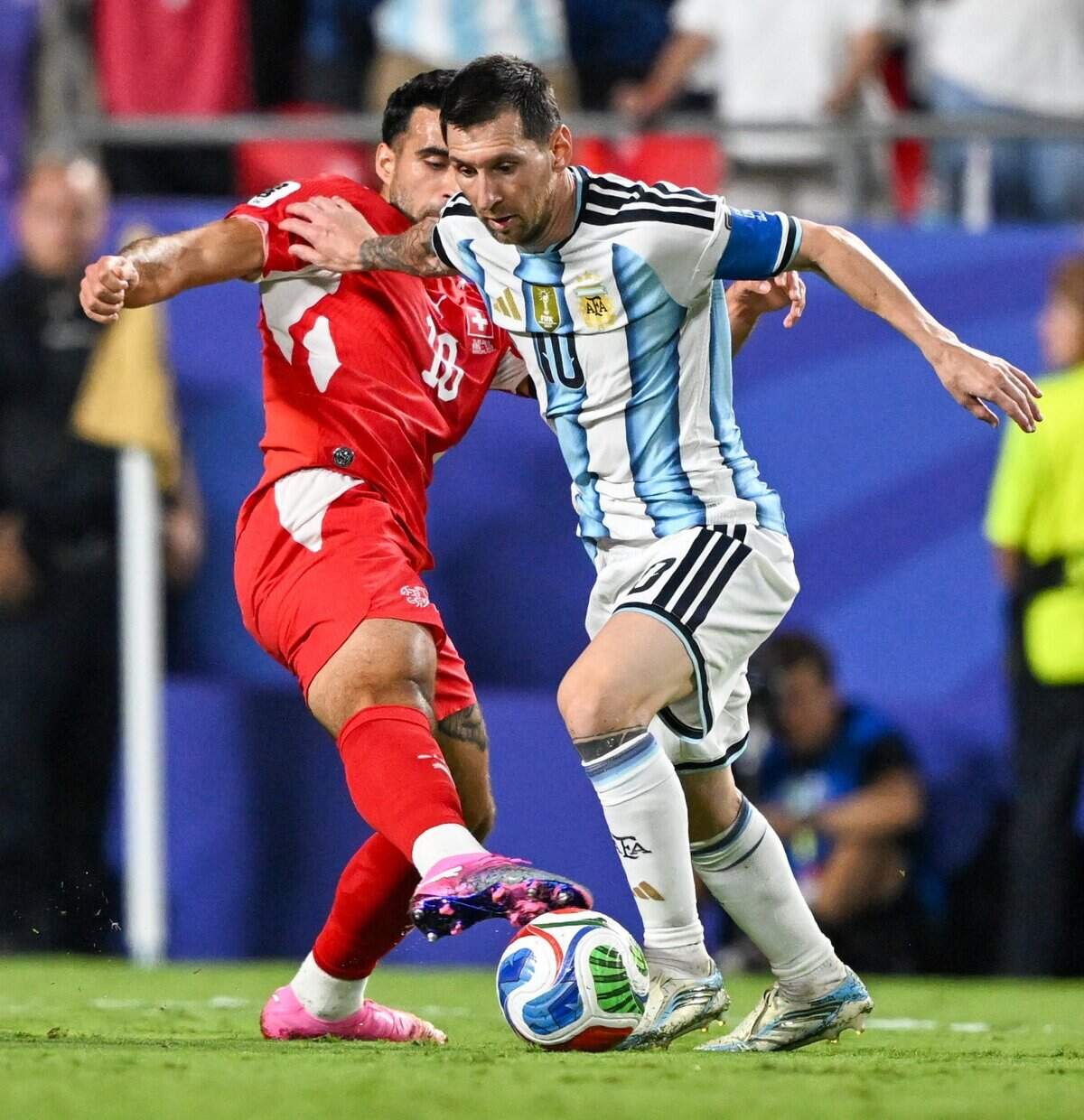 Argentina forward Lionel Messi (10) pushes off a Swiss defender as he tries to put his team ahead to win the match during extra time of the Argentina vs. Switzerland 2026 World Cup Quarterfinal football match at Kansas City (Arrowhead) Stadium in Kansas City on Saturday, July 11, 2026.