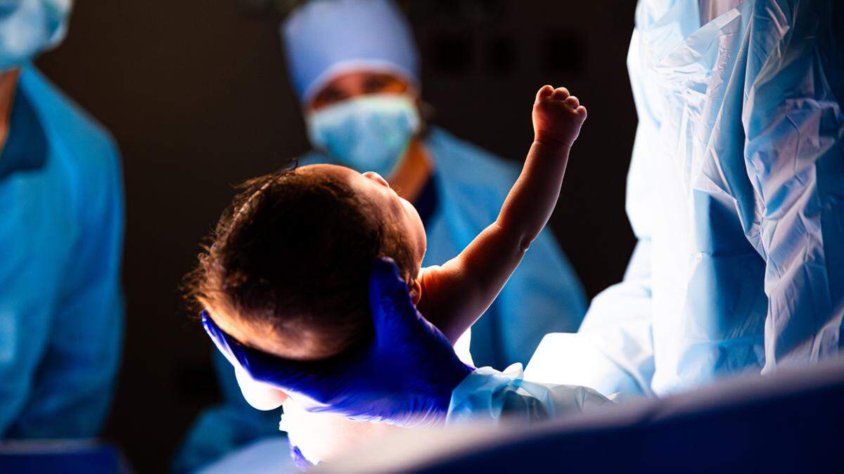 Hospital Operating room C section baby neonatal care birth mother childbirth child