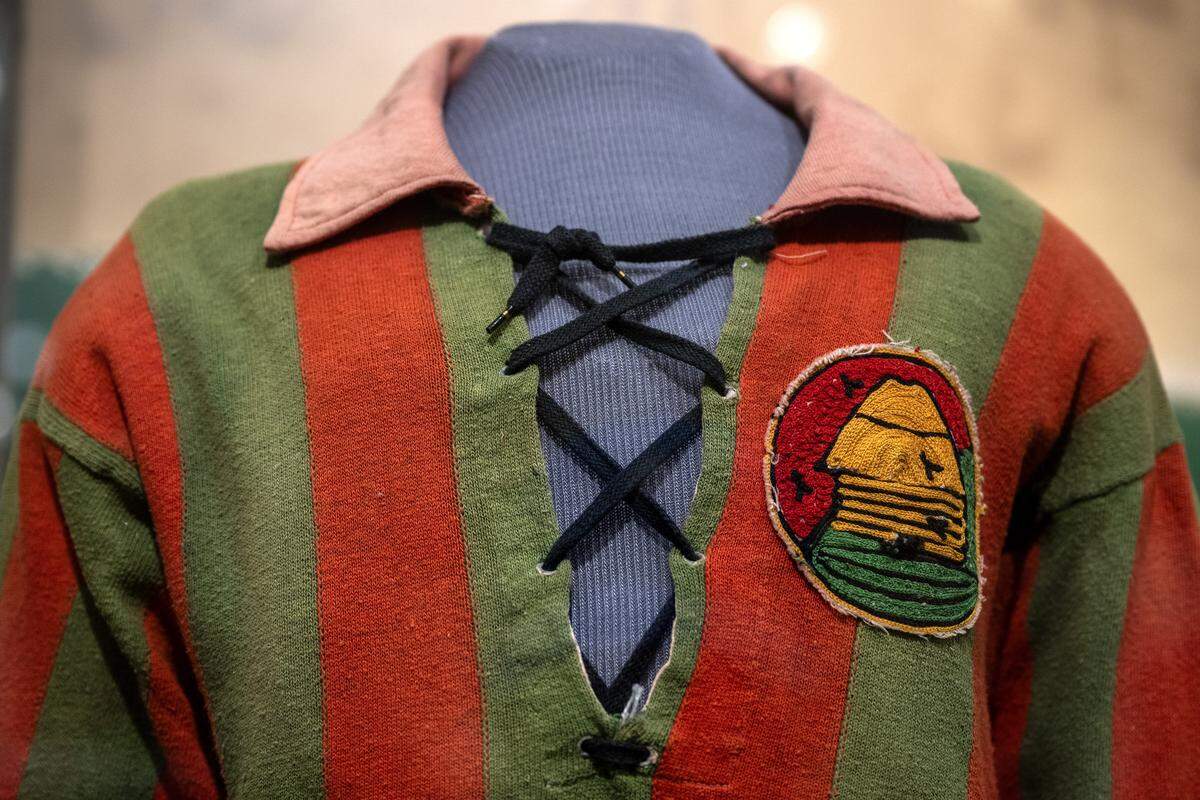 A postwar jersey worn by Hector Goetinck, with an unknown club emblem, is displayed in the new exhibition “The Beautiful Game,” highlighting the role of soccer during World War I, at the National WWI Museum and Memorial on Wednesday, April 1, 2026, in Kansas City.