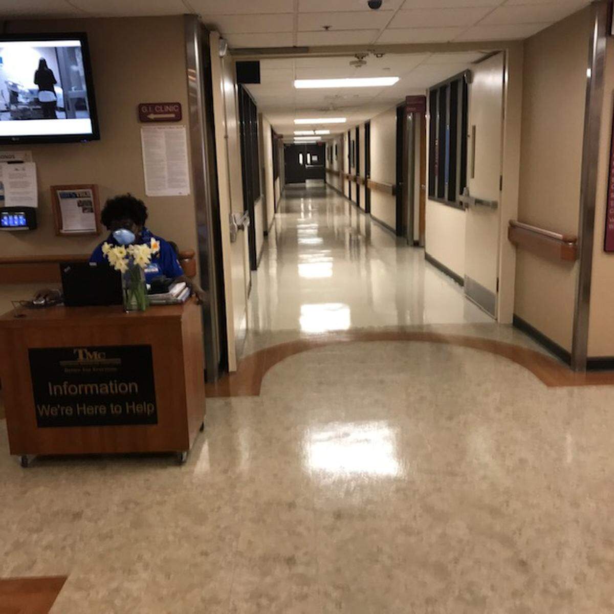 Halls inside Truman Medical Center are quiet and all but empty as the hospital cuts back on normal operations to prepare for the predicted surge in cases of COVID-19 .