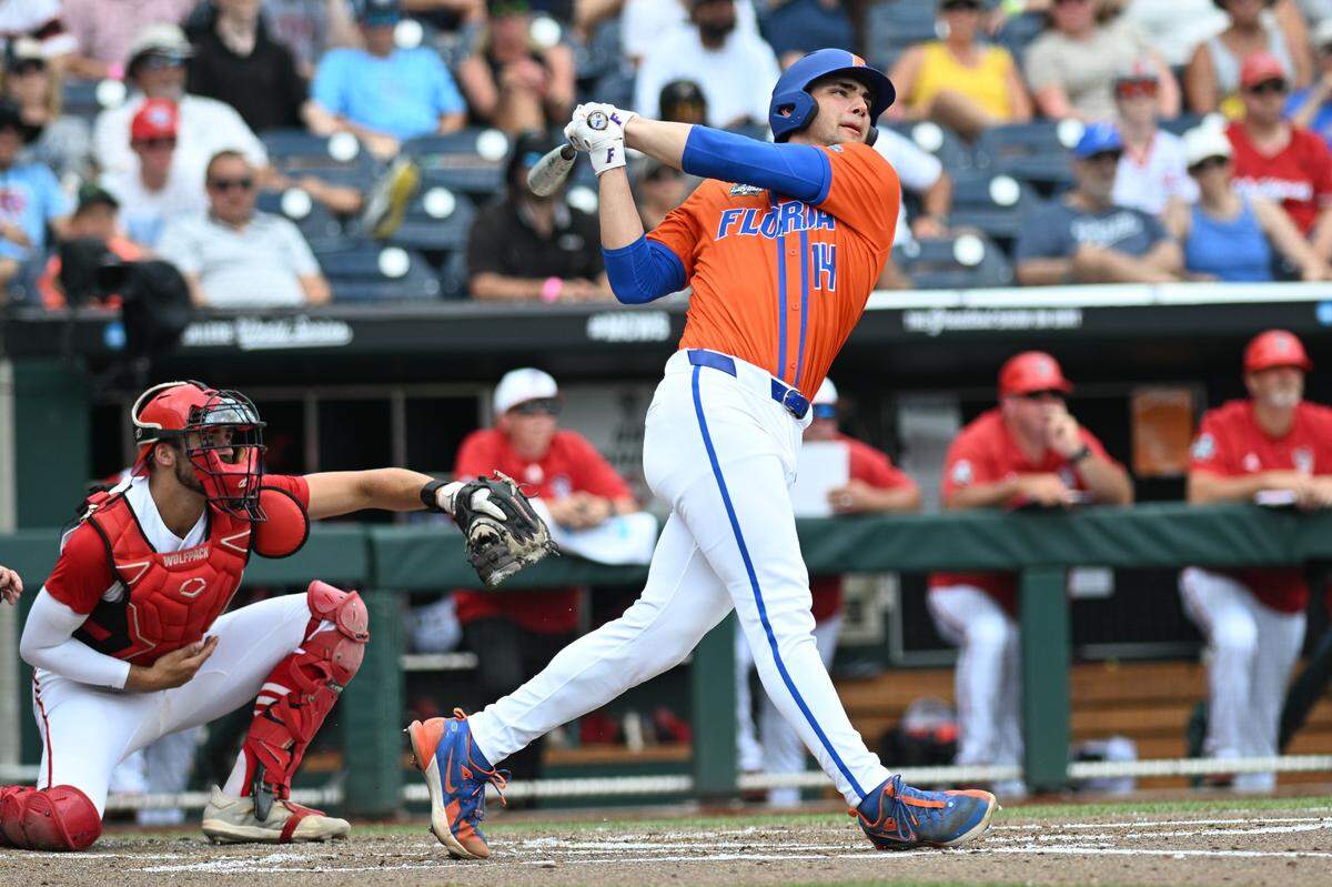 Florida Gators starting pitcher\designated hitter Jac Caglianone (14) hits a three run home run against the NC State Wolfpack during the second inning at Charles Schwab Field Omaha on Jun 17, 2024 in Omaha, NE, USA. 
