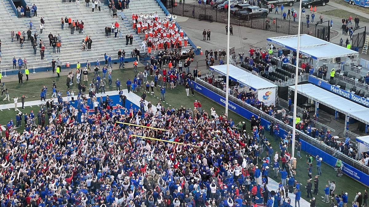 Giddy Kansas students tore down the south goalposts after KU became bowl eligible on Saturday by beating Oklahoma State at Booth Memorial Stadium.