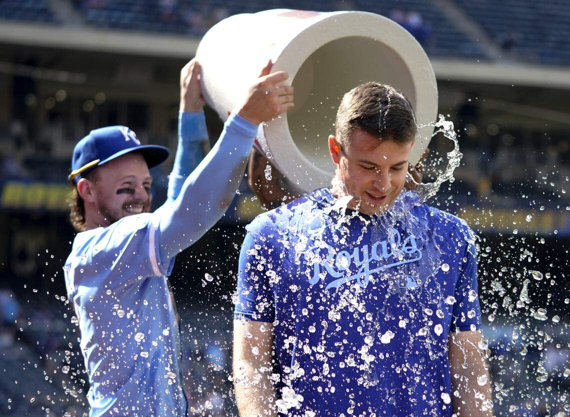 Kris Bubic #50 of the Kansas City Royals is doused with water by Bobby Witt Jr. #7 of the Kansas City Royals after a 10-0 win over the Chicago White Sox at Kauffman Stadium on May 08, 2025 in Kansas City, Missouri.