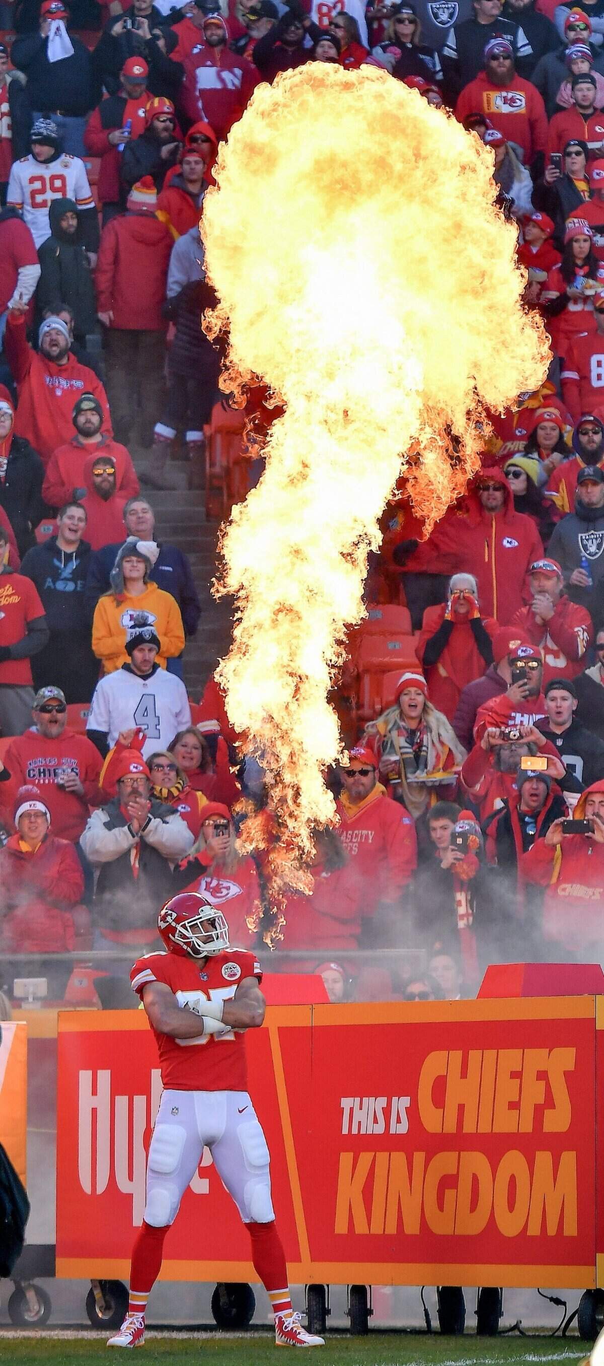 Travis Kelce stands next to a giant fireball as he is introduced before the start of the Chiefs’ game against the Oakland Raiders on December 10, 2017, at Arrowhead Stadium.