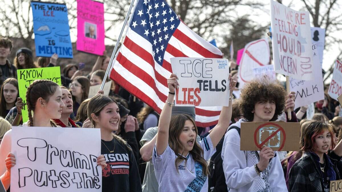 Students at Shawnee Mission North High School stood in protest of ICE and the Trump administration's policies along Johnson Drive on Wednesday, February 11, 2026, in Overland Park.
